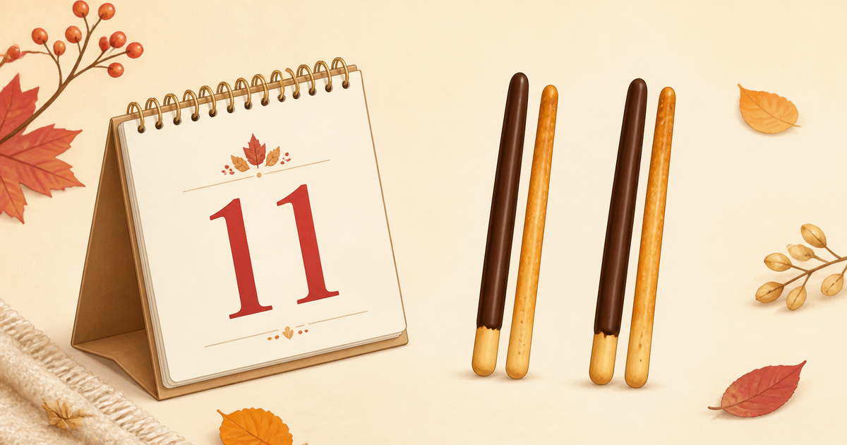 11月11日の卓上カレンダーと数字の1のように並んだ棒状のお菓子を描いた秋色のイラスト